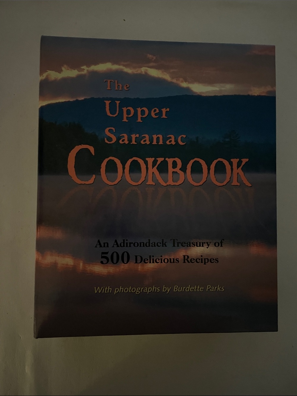 Upper Saranac Cookbook - Scenic Blue and Orange Cover